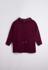 Sudadera con capucha burdeos de manga larga, con detalles de cordón y una textura suave. Diseño ligeramente oversize con un dobladillo redondeado.