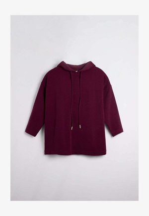 Sudadera con capucha burdeos de manga larga, con detalles de cordón y una textura suave. Diseño ligeramente oversize con un dobladillo redondeado.