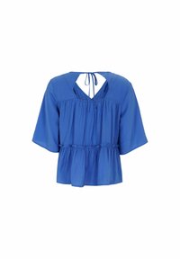 Top peplum blu con maniche corte, tessuto morbido, apertura a forma di V sulla schiena e dettaglio con fiocco sul collo. L'orlo arricciato aggiunge texture.