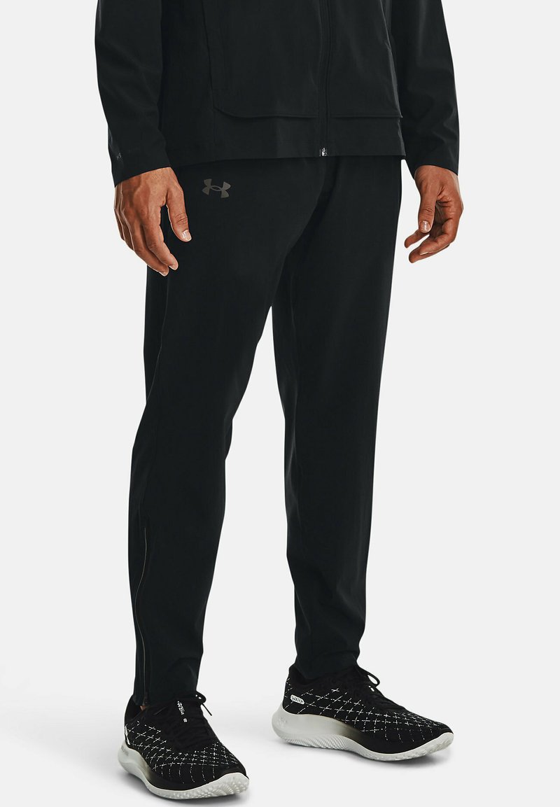 Under Armour - OUTRUN THE STORM - Tracksuit bottoms - black, Enlarge