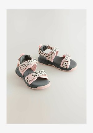 Spordisandaalid roosa ja valge leopardi mustriga rihmadega, kõveratega kinnitused, pehmendatud pahkluutoed ja mustad kummitaldad.