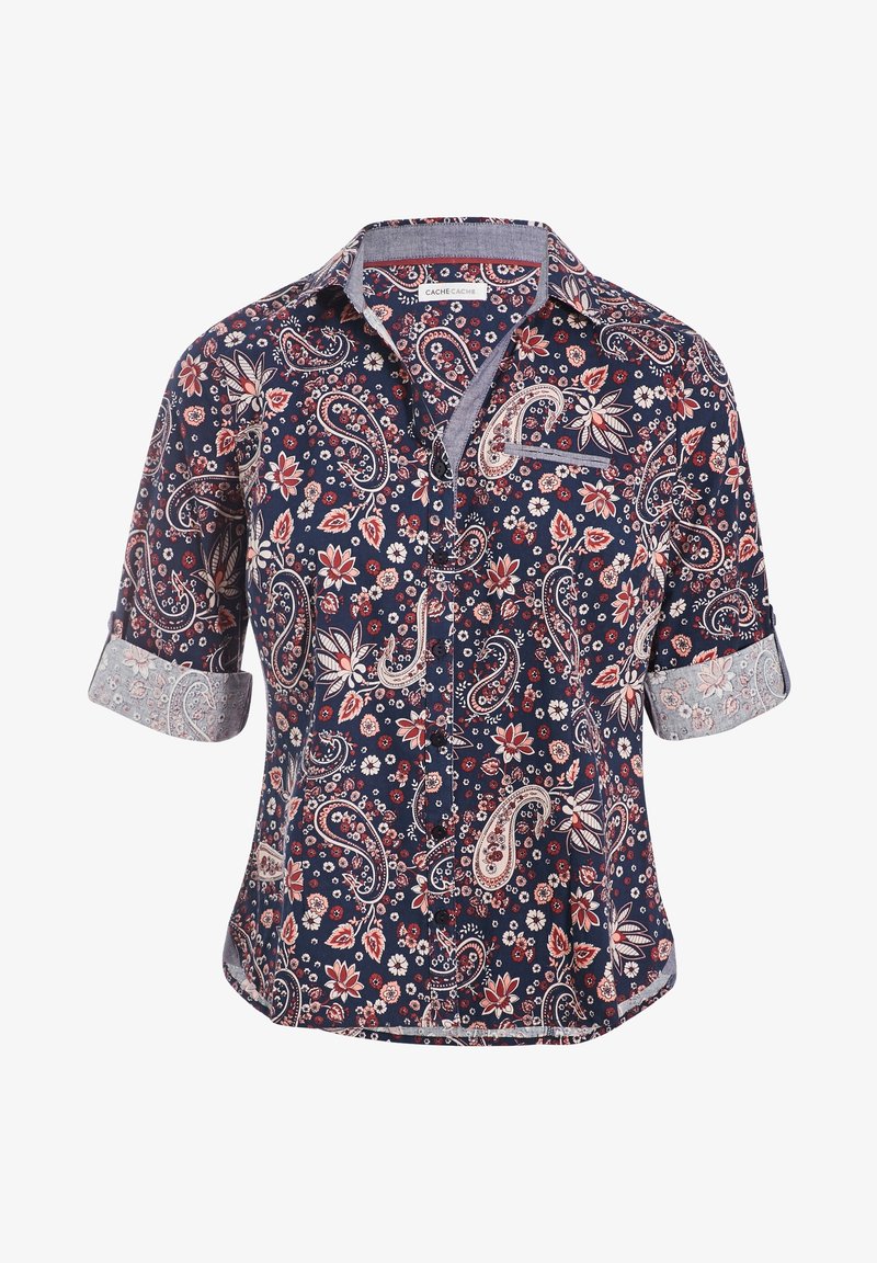 Marinblå skjorta med knappar som har ett paisleymönster i röd och vit, med korta ärmar och kontrasterande mönstrade manschetter.
