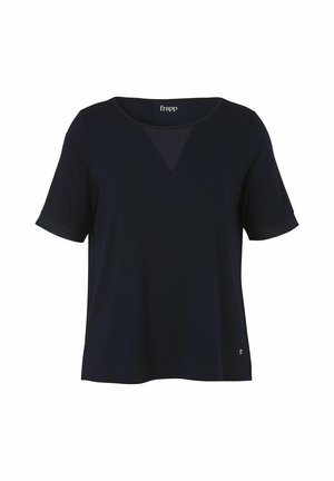 Dunkelmarinefarbene kurzärmelige Bluse mit einem leicht transparenten V-förmigen Einsatz am Ausschnitt und einem kleinen Metalllogo nahe dem Saum.