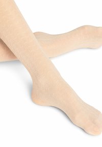 Beige gemusterte Strumpfhosen mit einem wellenförmigen Design, aus einem transparenten Material mit glatter Textur, das bis zur Wadenmitte reicht.