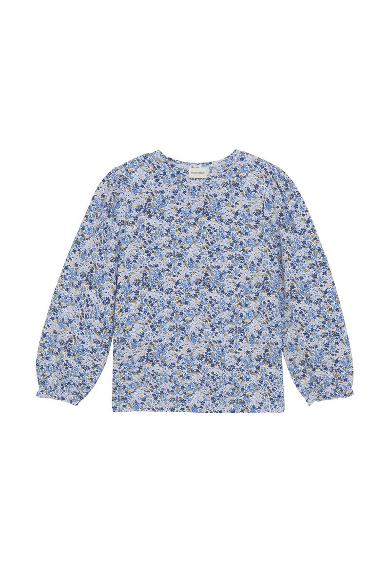 Langermet topp i lyseblåt stoff med blomstermønster som har blå og gule detaljer. Rund halslinning og rynkede ermer.