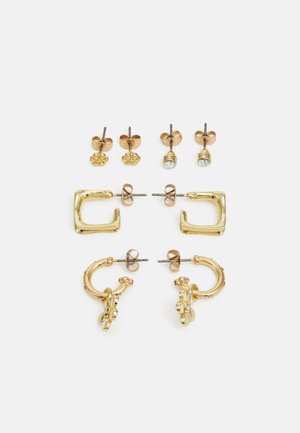 Set of gold-tone earrings including two pairs of studs, a chunky square design, and a floral accent hoop, showcasing various shapes and finishes.