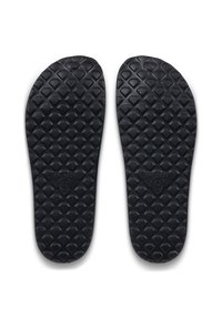 Semelles intérieures en caoutchouc noir avec un motif texturé en losanges pour une meilleure adhérence. Taille 42 indiquée au verso. Forme fine et plate sans soutien de la voûte plantaire.