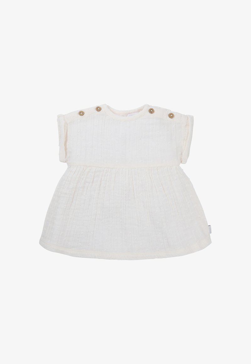 Biała bawełniana sukienka z krótkimi rękawami, teksturowana tkanina, z marszczonym wcięciem w talii. Posiada zapięcia na guziki na ramionach dla łatwego zakładania.