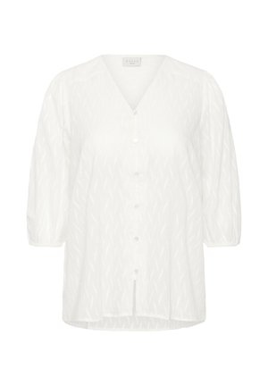 Valge pluus V-kaelusega, 3/4 puffvarrukatega ja nööb ees sulgemisega. Tekstureeritud muster kogu ulatuses, pehme kangas ja kaarekivi.