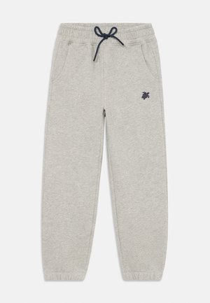 Grijze joggingbroek met een elastische tailleband en trekkoord, voorzien van zijzakken en een klein marineblauw logo op de linker dij.
