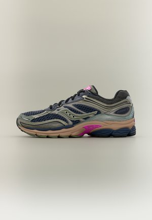 Running shoe with navy blue mesh, gray overlays, beige midsole, and pink and black sole accents, viewed from the side.