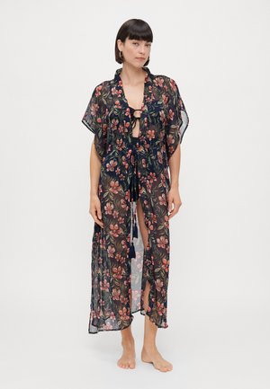 Sheer black kimono with floral pattern, short sleeves, open front, tie closure, and side slits. Decorative tassels at the ties.