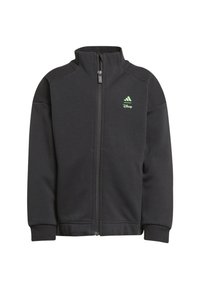 Giacca nera con zip realizzata in tessuto morbido, con un colletto alto e polsini a coste. Logo verde di Adidas e Disney sul petto.