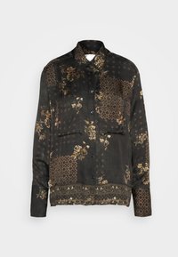 Camicia nera con motivo floreale in marrone e oro. Presenta un colletto, maniche lunghe e chiusura frontale con bottoni.
