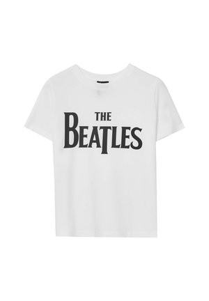 Maglietta in cotone bianco con la scritta "THE BEATLES" in grassetto nero, maniche corte, scollo rotondo e vestibilità comoda.