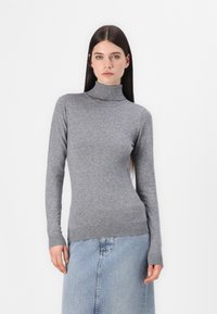 Gray turtleneck sweater made of soft knit fabric, with long sleeves and ribbed cuffs and hem, paired with a light blue denim skirt.