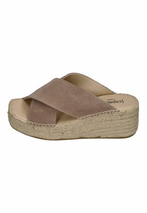 Beige suede slide sandal with wide crisscross straps and woven platform wedge sole.