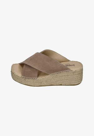 Beige suede slide sandal with wide crisscross straps and woven platform wedge sole.