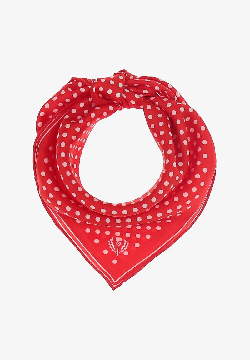 Écharpe en soie rouge à pois blancs avec un petit emblème floral, pliée et nouée en forme triangulaire.