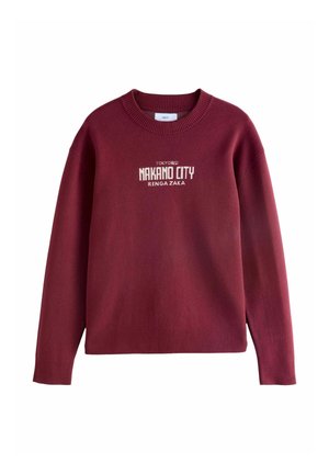 Burgundia säärise crew kaelusega, esiosas on valge kiri „TOKYO NAKANO CITY RENGA ZAKA“ tikitud. Pehme kudum.