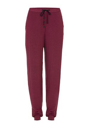 Bordowe spodnie dresowe z miękkiego materiału, z paskiem na sznurek w talii, guzikiem z przodu oraz zwężonymi nogawkami przy kostkach.