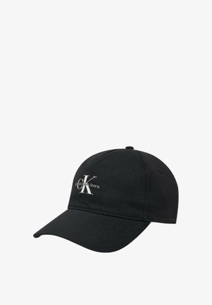 Cappellino da baseball nero in cotone con visiera curva, dotato di un logo ricamato bianco "CK" e della scritta "Calvin Klein Jeans" nella parte frontale.