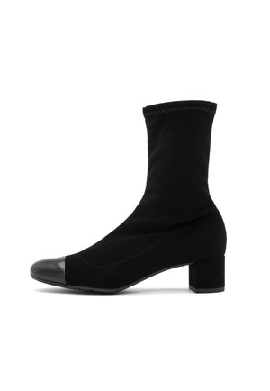 Black ankle boot in smooth fabric with a block heel. Features a rounded toe and contrasting leather toe cap. Seam detailing along the upper.
