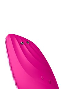 Dispositif en silicone rose vif avec une forme épurée, une texture striée et deux boutons argentés en haut pour la fonctionnalité.