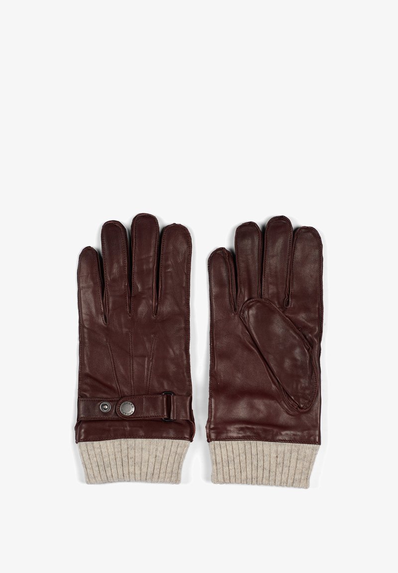 Ruske nahkakinnas, jossa on ribattu beige neulosraja, sivuolka, jossa on napsulukko ja sileä pinta.