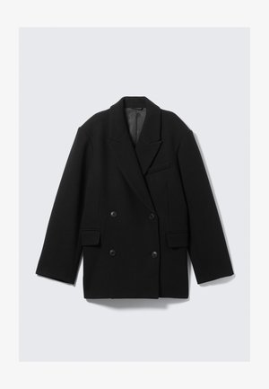 Cappotto nero doppiopetto in misto lana, con revers a punta, due tasche frontali e una finitura strutturata.