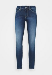Jeans ajustados de denim azul oscuro con un frente ligeramente desgastado. Cuenta con cinco bolsillos, un cierre de botón y costuras en tono plateado.
