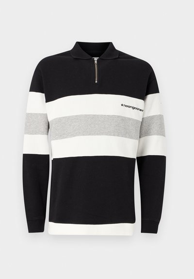 Sudadera negra, blanca y gris a rayas con cuello con cremallera. Fabricada con un tejido suave que presenta un logo cerca del cuello. Mangas largas, ajuste holgado.