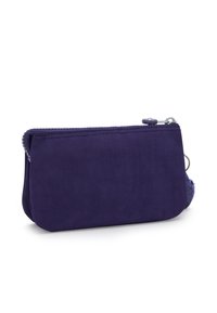 Purple fabric zippered pouch with rounded edges, metal zipper pull, and a small attached ring on a white background.