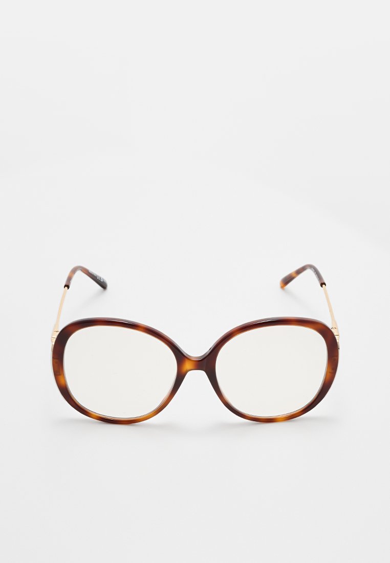 Schildkrötenmuster-Sonnenbrille mit übergroßer, runder Form, dünnen Metallbügeln und klaren Gläsern. Verfügt über minimale Hardware-Akzente.