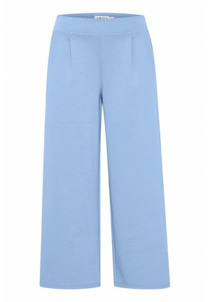 Heledad laiad sinised püksid, mis on valmistatud pehmest kangast. Neil on sile vöökoht ja kaks esi ploome, et lisada struktuuri.