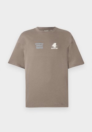 Brown cotton t-shirt with a round neckline. Features blue text "Universal Athletic Apparel" and white "4th quarter" logo on the front. Short sleeves.
