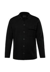 Camicia nera a maniche lunghe realizzata in tessuto texturizzato, con colletto, sei bottoni sul davanti e una tasca sul petto.