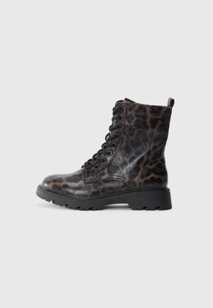 Black and brown leather combat boots with leopard print, round toe, lace-up design, and textured rubber sole for grip.