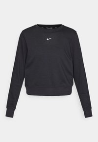 Sweatshirt noir court en tissu doux, avec un col rond et des manches longues. Logo Nike blanc centré sur la poitrine.