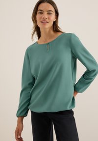 Teal lange mouwen blouse van gladde stof, met een ronde halslijn en een kleine knoopsluiting in de sleutelgatdetail, en geraffineerde manchetten.