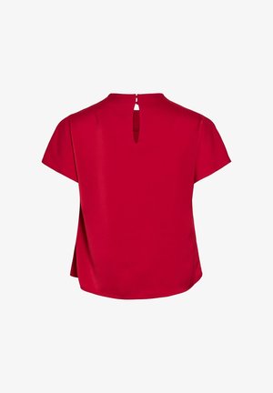 Punane lühikeste varrukatega pluus, millel on võtmeava selja detail, pehme tekstuur ja lõdvendatud lõige, ümaral hemline'il lisaks dimensioonile.