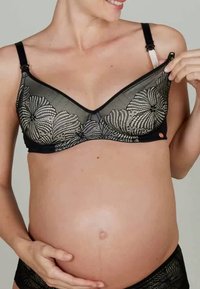 Svart blonde amming BH med blomsterdesign, justerbare stropper og en jevn svart kant, designet for komfort og støtte under graviditet.