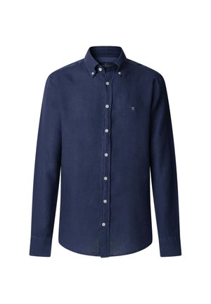 Chemise bleu marine à col boutonné en tissu doux. Manches longues, col pointu et petit logo brodé sur la poitrine. Boutons clairs.