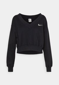 Svart kort sweatshirt med V-ringning, tillverkad av mjukt tyg, med en liten vit Nike-logga på vänster bröst och långa ärmar.