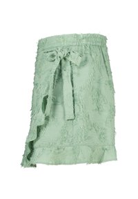 Mintgroene rok van gestructureerde stof, met een verfrommeld randje, een rucheszoom en een verstelbare strik in de taille.