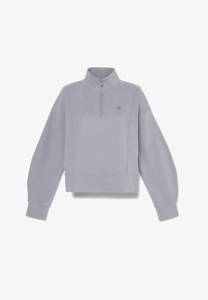 Sudadera de color púrpura claro con media cremallera en el cuello, puños y dobladillo acanalados, que presenta un pequeño logo en el pecho y un diseño de corte relajado.