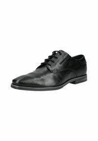 Zapato de vestir de cuero negro con puntera perforada, acabado liso, forma puntiaguda y suela plana. El sistema de cordones es visible en la parte superior.