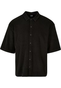 Camisa negra de manga corta hecha de una tela suave, con cuello tipo solapa y seis botones frontales, diseñada con un corte relajado.