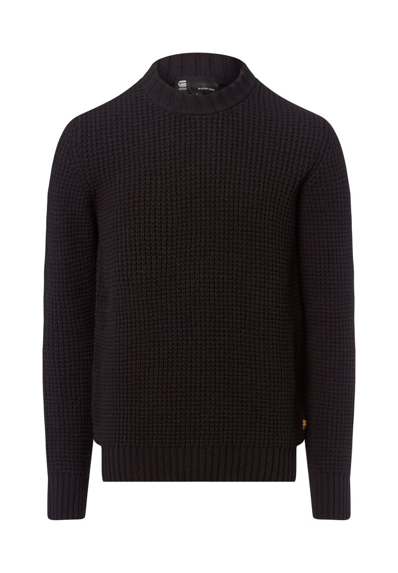 Zwarte gebreide trui met een ronde halslijn, een textuurpatroon en geribbelde manchetten en zoom. Beschikt over een klein logo aan de zijkant.