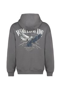 Grauer Hoodie mit einem grafischen Druck eines Adlers und dem Text "WORLDWIDE TOUR" auf der Rückseite. Verfügt über eine verstellbare Kapuze und gerippte Bündchen.